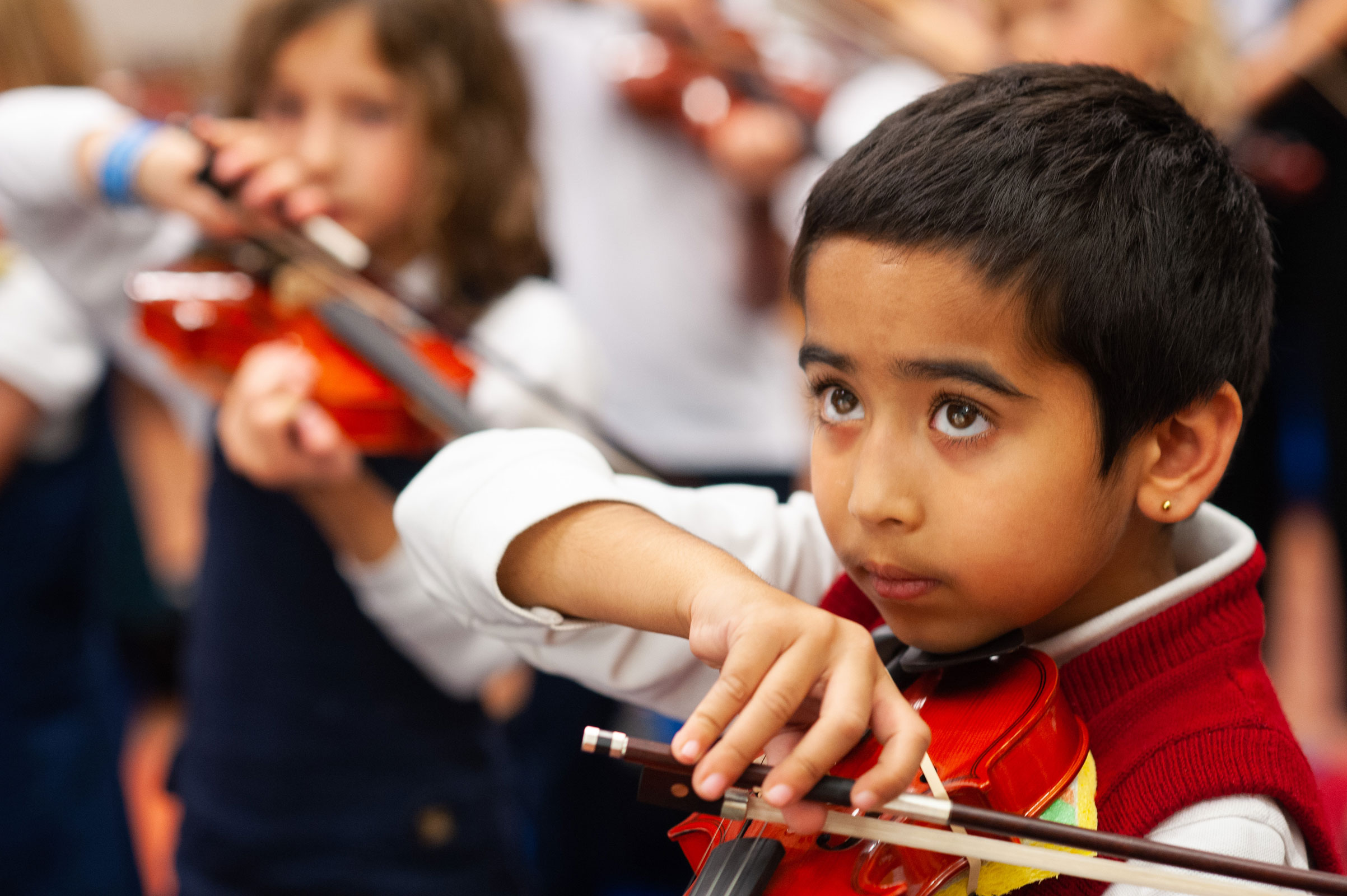 British-School-Editorial-Style-Photography-Closeup-Student-Playing-Violin-in-Class